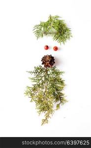 Gnome or elf face from natural materials. Christmas silhouette picture in minimalistic design concept. minimalistic elf face