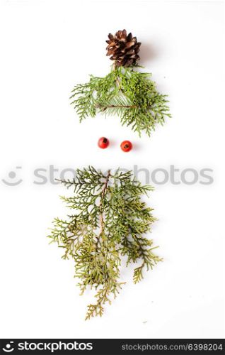Gnome or elf face from natural materials. Christmas silhouette picture in minimalistic design concept. minimalistic elf face