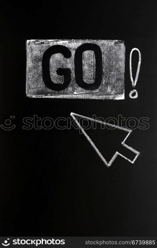 Go button with an arrow drawn in chalk on blackboard