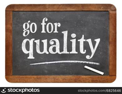 go for quality sign - white chalk text on a vintage slate blackboard