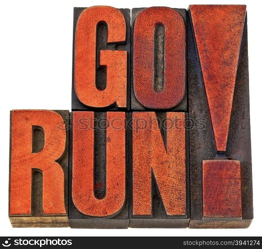 go run motivation banner - fitness concept - isolated word abstract in letterpress wood type stained by red ink
