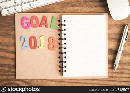Goal word of wood on notebook,goal setting concept