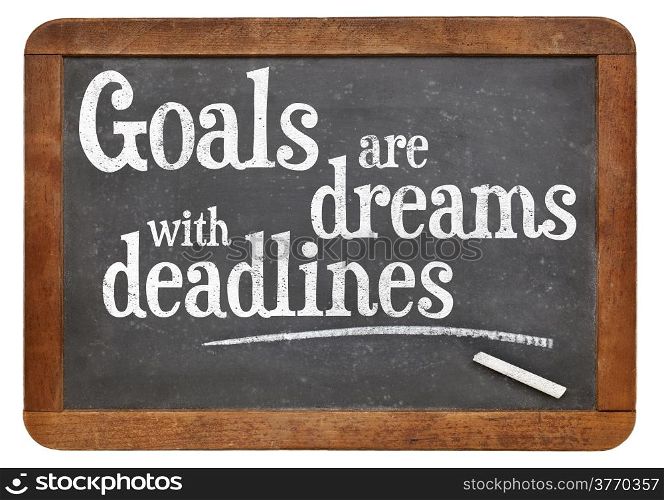 Goals are dreams with deadlines - motivational phrase on a vintage blackboard