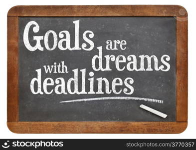 Goals are dreams with deadlines - motivational phrase on a vintage blackboard