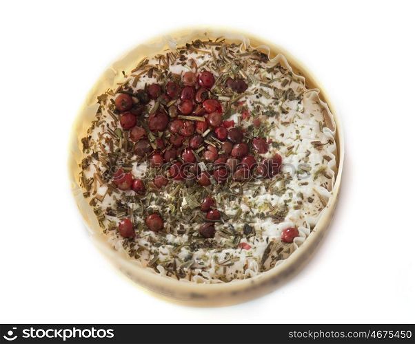 goat cheese with herbs in front of white background