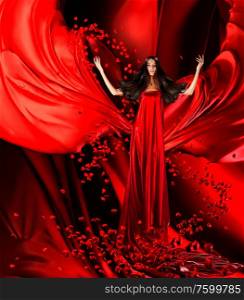 goddess of love in long red dress with magnificent hair makes a magic ritual of connecting hearts of people on red drapery, fabric