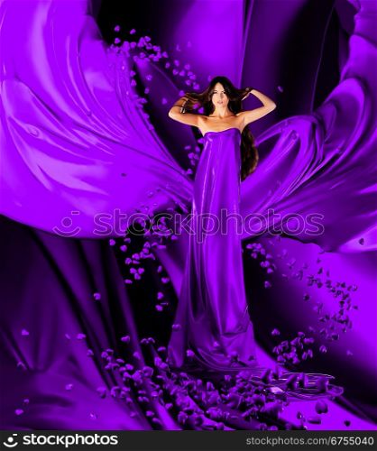 goddess of love in long violet dress with magnificent long hair makes a magic ritual of connecting hearts of people on blue drapery, fabric
