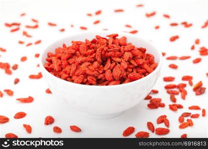 Goji berry in white bowl isolated on white background