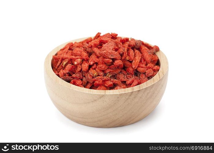 Goji berry in wooden bowl isolated on white background with clipping path