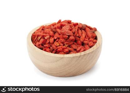 Goji berry in wooden bowl isolated on white background with clipping path