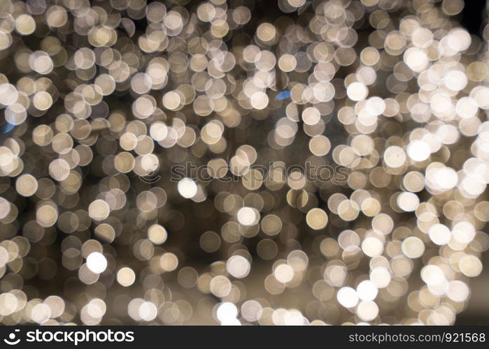 Gold abstract bokeh background. Defocused glitter lighting image for art and design.