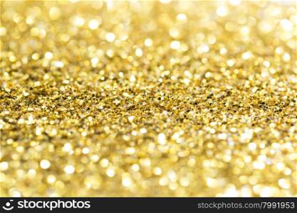 Gold abstract glitter background with copy space. Gold bokeh glitter background with copy space