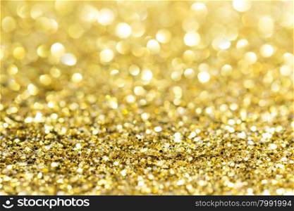 Gold abstract glitter background with copy space. Gold bokeh glitter background with copy space