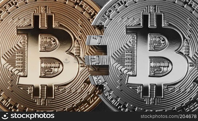 Gold and silver coins bitcoin on a black background. The concept of blockchain technology and money transfers. Mastercard analog concept. Cryptocurrency and blockchain trading concept. Can be used for video or site cove. Two coins bitcoin on a black background money transfer concept.