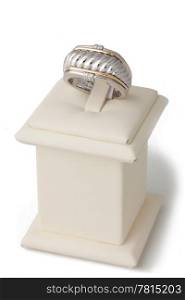 Gold and silver ring on display stand