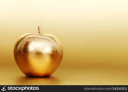 gold apple on gold background