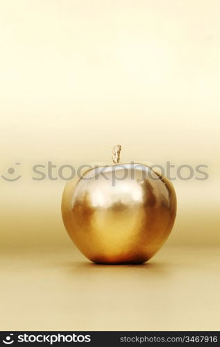 gold apple on gold background