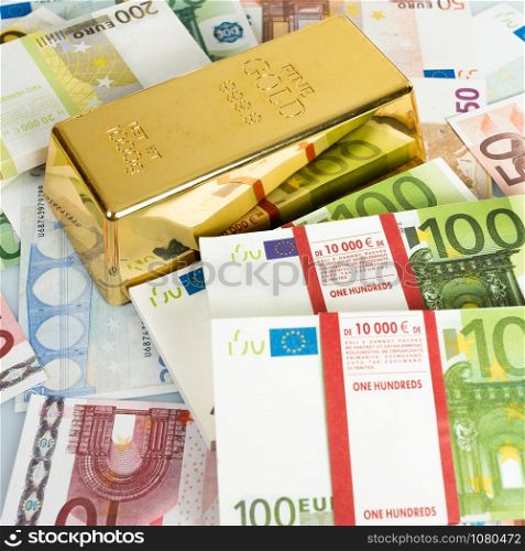 Gold bars and Euro banknotes. Gold bullion and money
