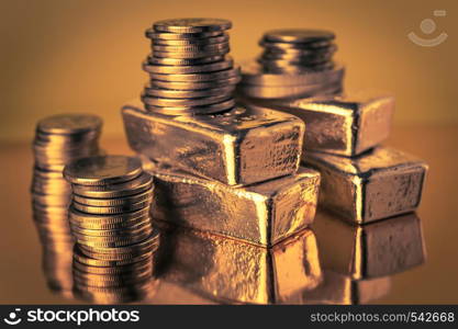 Gold bars and stack of gold coins macro. Rows of coins and gold ingots for finance and banking concept. Economy trends background for business idea. Trade in precious metals. Close up,Selective focus.. Gold bars and stack of gold coins. Background for finance banking concept. Trade in precious metals.