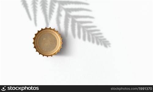 Gold beer bottle caps on a white background .beer fiesta concept