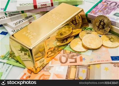 Gold Bitcoin BTC coins with bills of euro banknotes and gold bullion