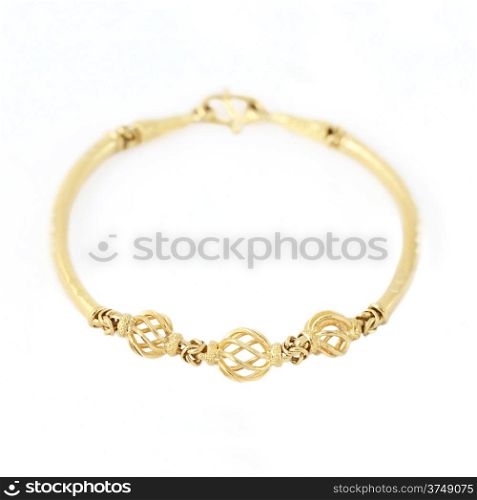 Gold bracelet isolated on white background