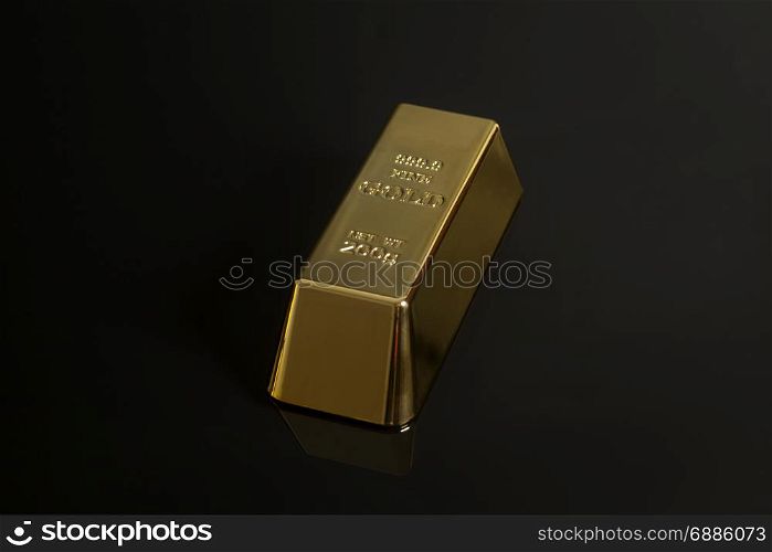 Gold bullion on black background