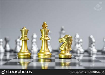 Gold Chess King, Queen and Knight (horse) figure on Chessboard against opponent or enemy. Strategy, Conflict, management, business planning, tactic, politic, communication and leader concept