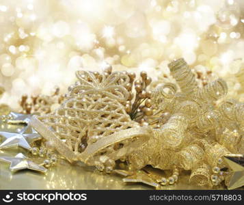 Gold Christmas background with decorations, bokeh lights and stars