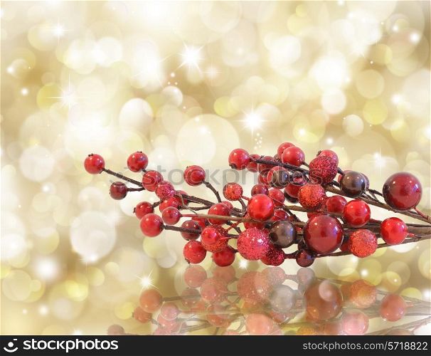 Gold Christmas background with red berries. bokeh lights and stars