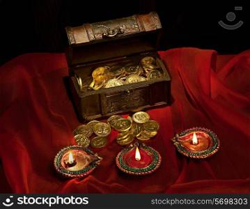 Gold coins and diyas