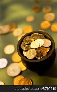 Gold coins in a pot