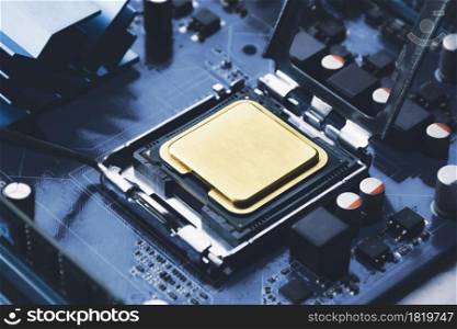 Gold CPU processor chip in connector socket on the computer motherboard and component