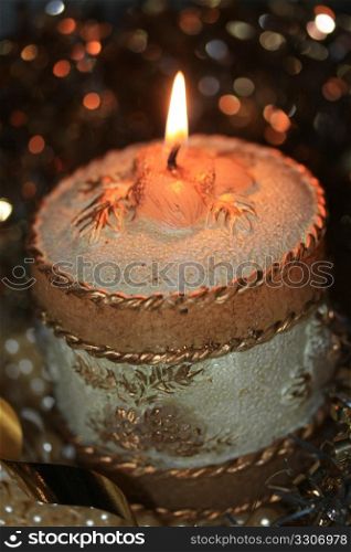 Gold decorated christmas candle and christmas docorations