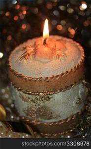 Gold decorated christmas candle and christmas docorations