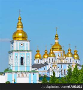 Gold Domes of an orthodox St. Michael&rsquo;s Cathedrall against the blue sky in Kiev. Capital of Ukraine - Kyiv.