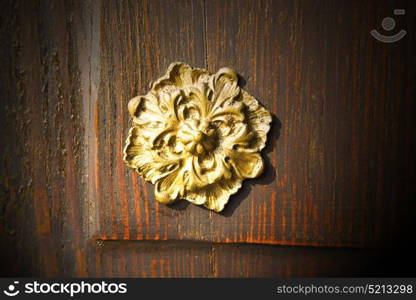 gold face abstract house door in italy lombardy column the milano old closed nail rusty