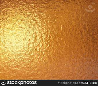 gold foil. a very large sheet of fine crinkled gold aluminium foil