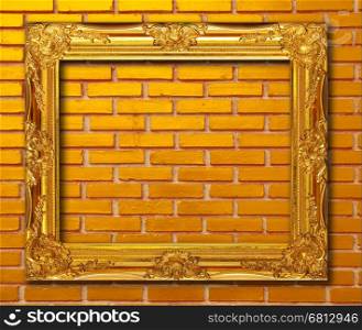 Gold frame on brickwall