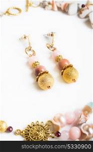 gold handmade earrings with pink semipreciouses. nephritis and variscite