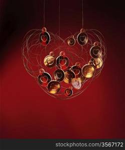 gold hearts in wire heart on red background