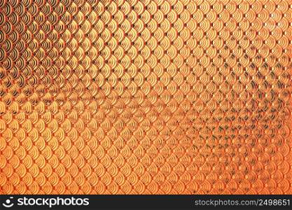 Gold holographic dragon or mermaid fish scales iridescent faux leather texture background.