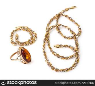 Gold Jewellery with amber on white. Studio Photo. Gold Jewellery with amber
