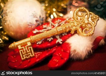 Gold key against Christmas toys