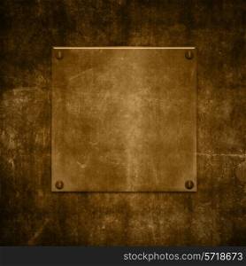 Gold metal plate on a grunge background