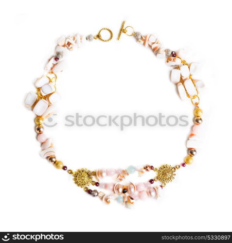 gold necklace with pearls and pink quartz and earringsat white background