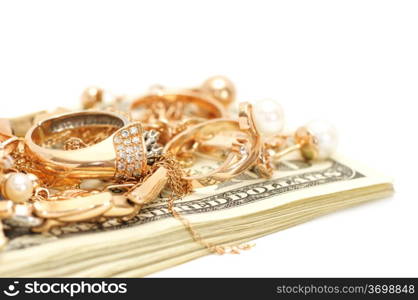 Gold ornaments and dollars isolated on a white background.