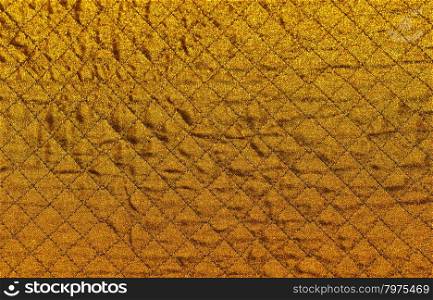 Gold rhomboid fabric background