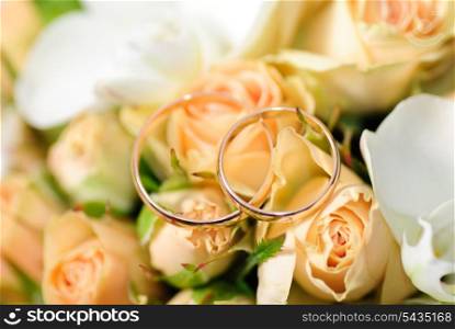 Gold rings on a bouquet of roses. Shallow DOF, selective focus