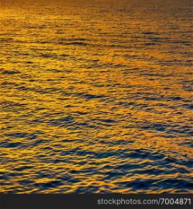 Gold sea water at sundown, may be used as background
